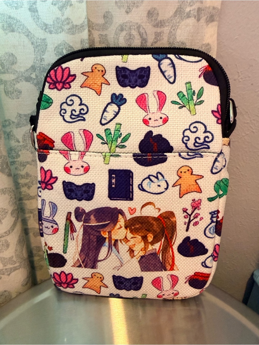 LevloAnime Print Crossbody Pouch in White with Multicolor Characters